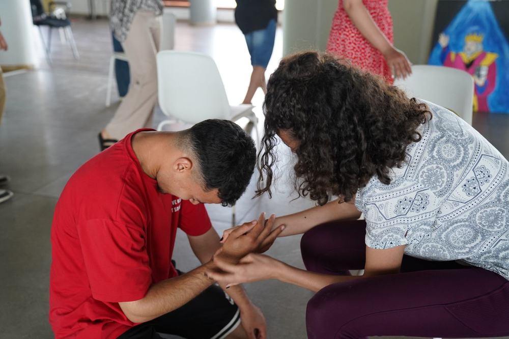 Two participants in a paired trust exercise