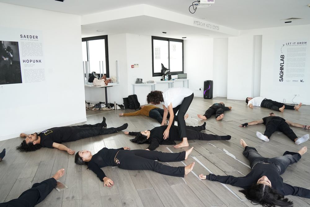 Guided floor exercise during a workshop at the American Arts Center